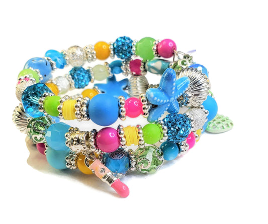 Whimsical Charm Bracelet featuring a lipstick, handbag, starfish and dress charms, 3 Coil Memory Wire Bracelet